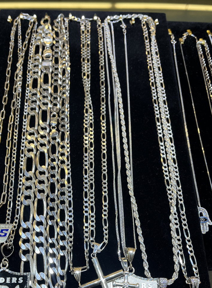 A bunch of silver chains are on display