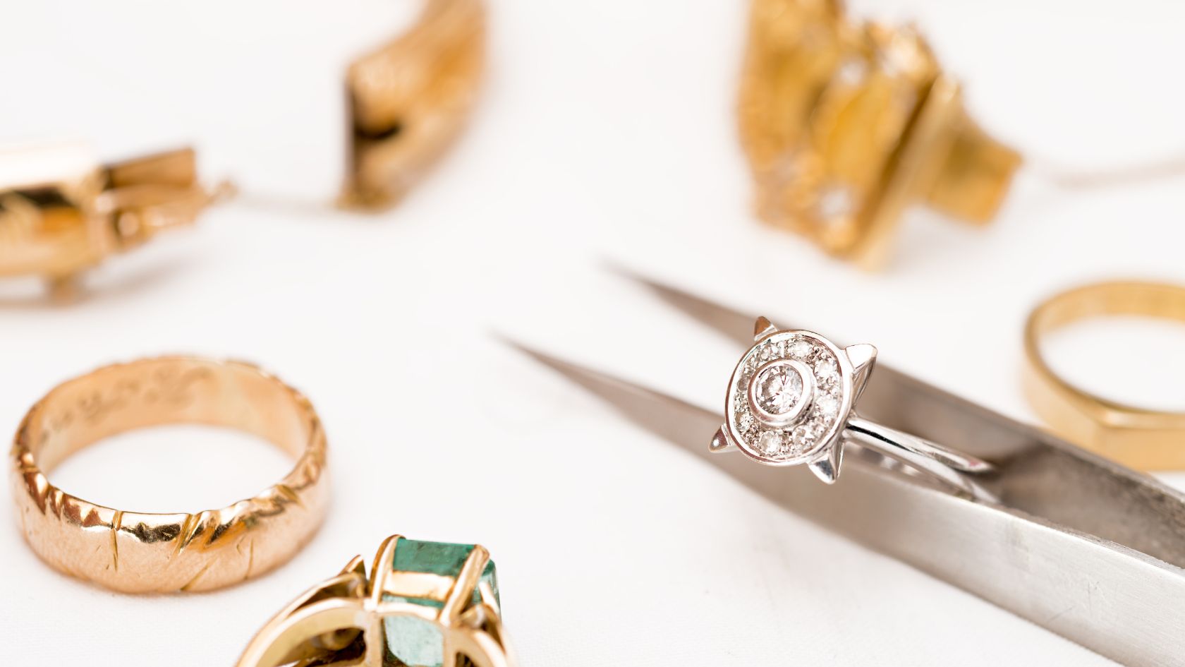 A pair of scissors and some rings on a table